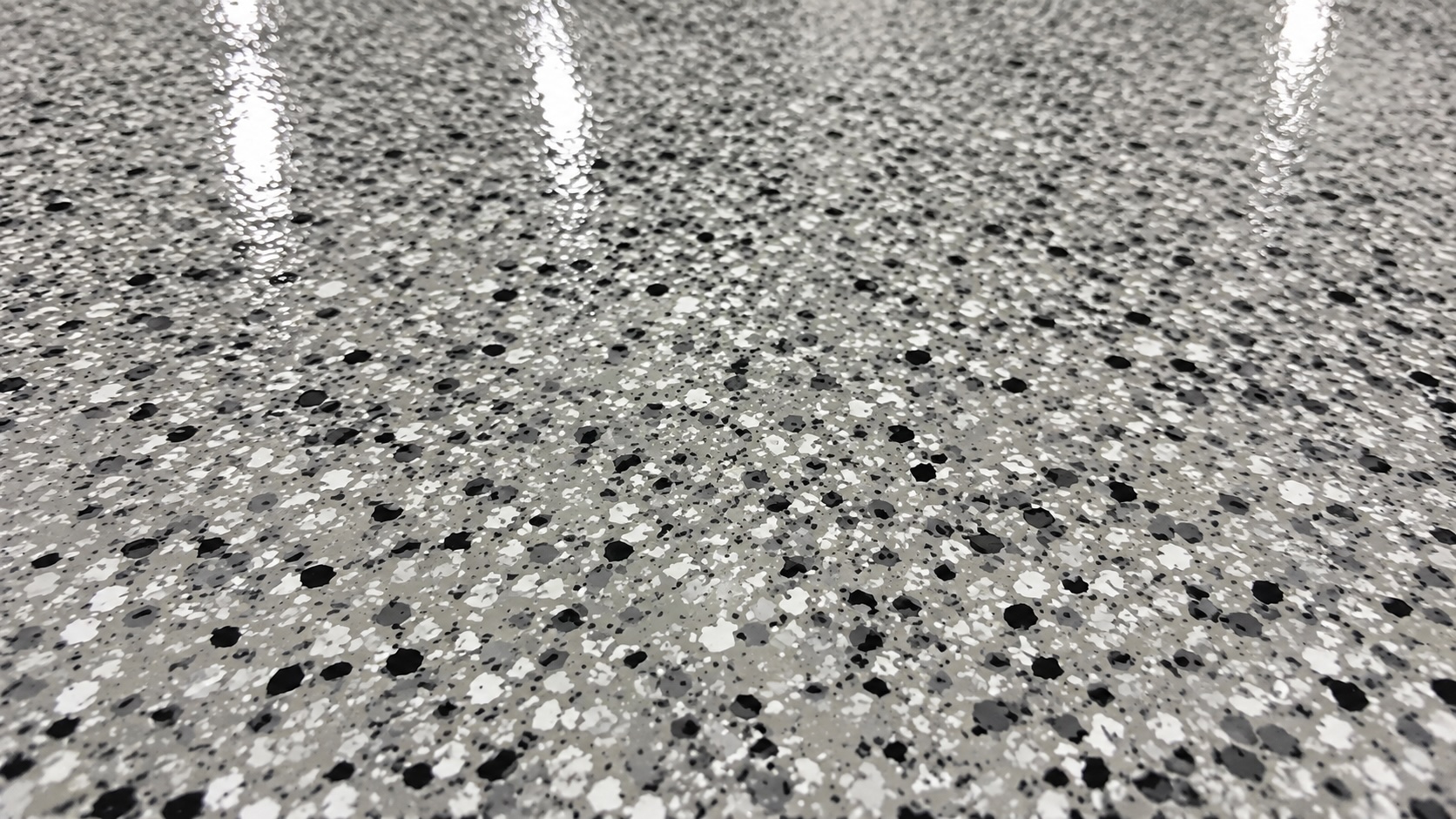 High-gloss polyaspartic floor coating in a residential garage in St. George, Utah